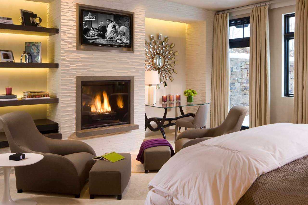 Спальня с камином  сочетание с телевизором в интерьере, как все разместить Преимущества электрической печи в маленькой комнате Правильное оформление дизайна, примеры с фото
